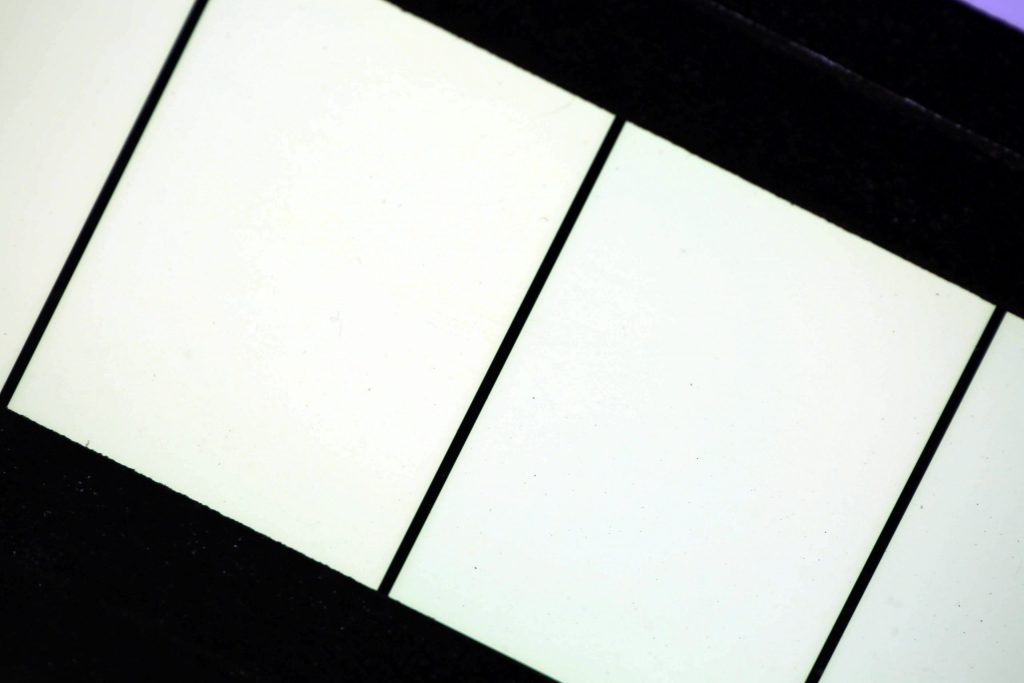Warp & Weft by Brian Black; Computer-generated animation, recorded onto motion picture film. Then, printed film is laid out and mounted onto a custom-built light box for display